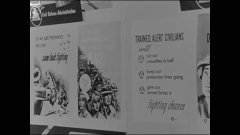 1950s: Posters.  Information booth.  Paintings of people fleeing, hospital and Stock Footage 147600899