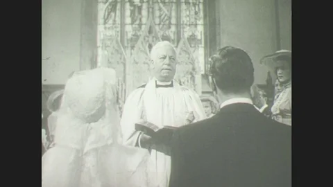 1950s: Priest marries young man and woman. Family picnics at river. Men and Stock Footage