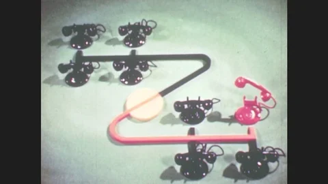 1950s: Puppet stands outside bathroom door, bangs on door, Puppet sits in Stock Footage 79474922