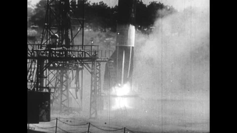 1950s: Rocket on launch pad falling over / Long shot, rocket falls and explodes Video stock 74511883