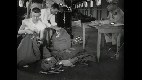 1950s - ROTC students spend a few weeks at a real army boot camp, where they Stock Footage 143838628