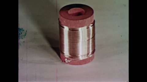 1950s: spool of copper wire, diamond ring, other metals that are composed of Video stock 118148073