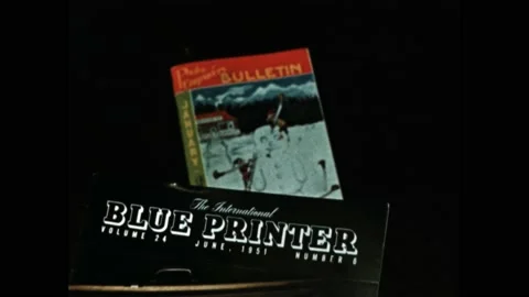 1950s: Stack of magazines on subject of photography. Reference books on top of Stock Footage 170456271