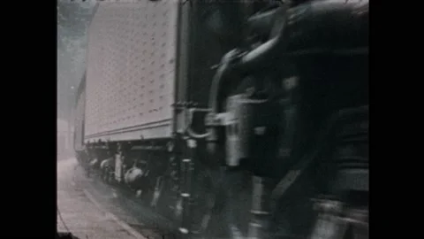 1950s: Steam train barrels down the tracks. Computer control room. Moving Видео 232179897
