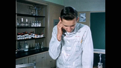 1950s: Student looking down, thinking intensely. Student fidgeting with pencil, 스톡 동영상 165605552