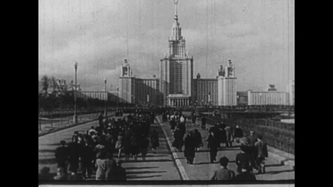 1950s: Students walk toward Soviet university / Students walk up steps / Stock Footage