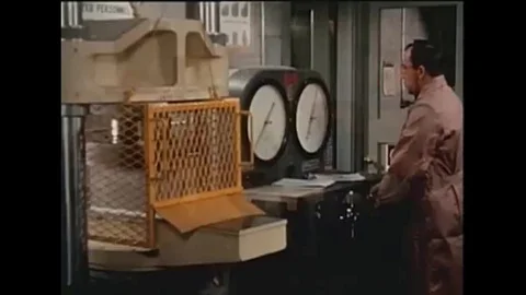 1950s Tests are conduct in a lab on cement blocks, engineers test the quality Stock Footage 115550750