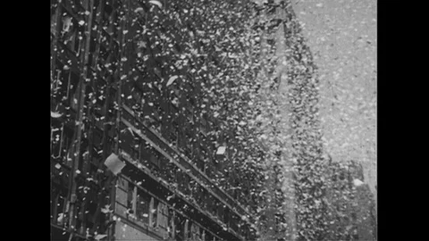 1950s: Ticker tape falls from building in New York City parade / Douglas Stock Footage