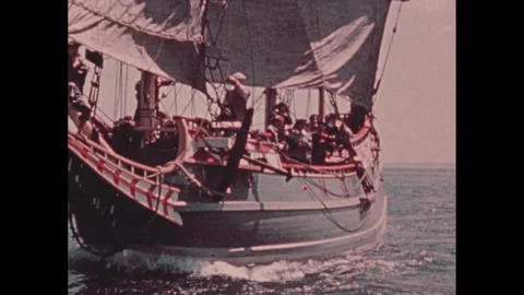 1950s: Tilt down tall ship at sea. Man and boy plowing field with horse. View of Stock Footage 266844688