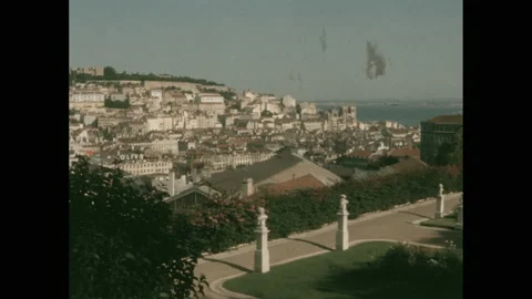 1950s: Town next to harbor. Man stacks boxes at dock. Two men and two women 스톡 동영상 140164280