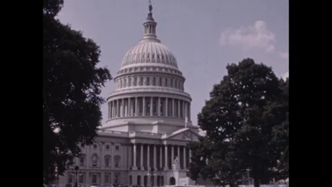 1950s: Trees stand outside Capitol Building in Washington DC. Vídeo Stock 244408584
