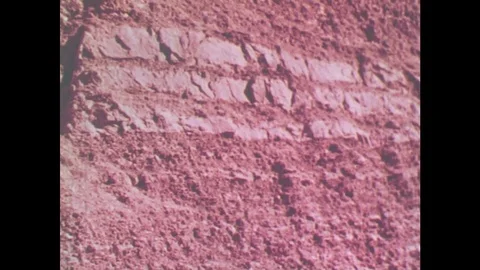 1950s: UNITED STATES: broken lines in rock layers. Sedimentary rocks. Up and Stock Footage