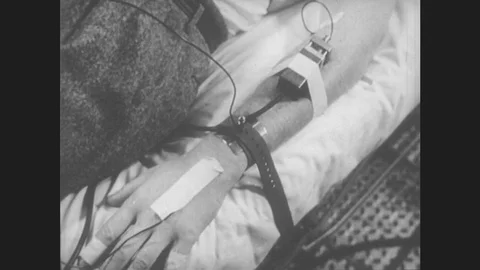 1950s: UNITED STATES: close up of hand during experiment. Heart in situ during Stock Footage