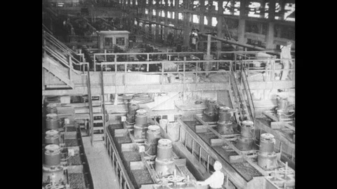 1950s: UNITED STATES: floatation machines inside copper processing plant. Blades Video stock 88304896