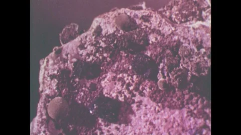 1950s: UNITED STATES: malachite rock formations. Volcanic explosion in crust of Stock Footage