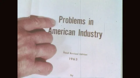 1950s: UNITED STATES: Problems in American Industry title in book. Revised Video stock 80208993