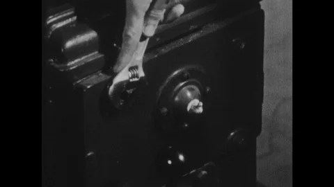 1950s: Using wrench to tighten bolt. Planning wood in vice. Using a chisel to Stock Footage 116052853