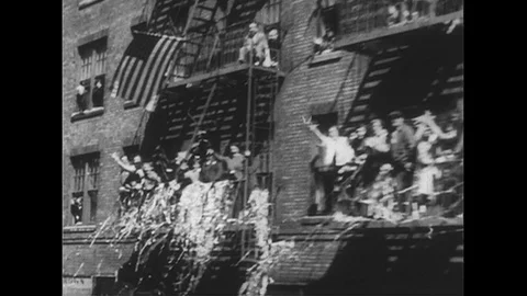 1950s: View from car of crowd cheering / Views of New York City street, ticker Stock Footage
