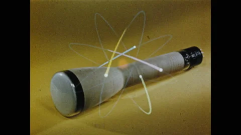 1950s: View of cathode ray, animation of atom superimposed over image. Close up Stock Footage 130357594