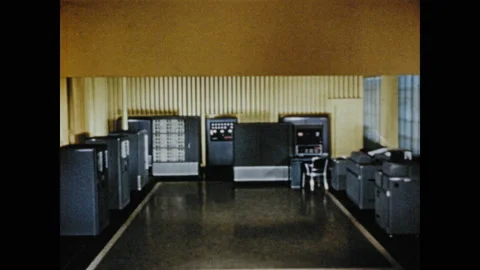 1950s: View of data processing machines. Exterior of building. Man working with Stock Footage 130357892