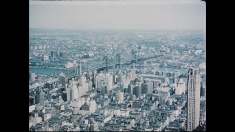 1950s: View of New York City from above, Chrysler Building. Guide stands on Stock Footage