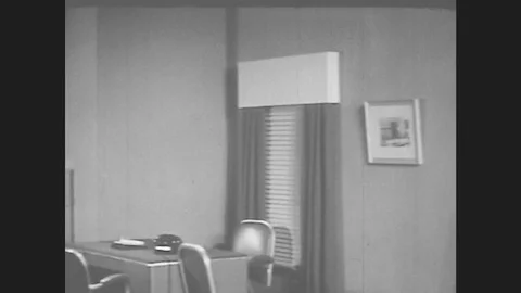 1950s: View Of Office. Picture In Frame Shows Another Room Or Office. Stock Footage