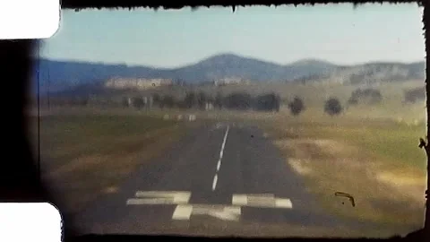 1950s View from small plane of landing on runway. Vintage 8mm Home Video. Stock Footage 279860838