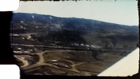 1950s View from small plane over wing. Vintage 8mm Home Video. Stock Footage 279860694