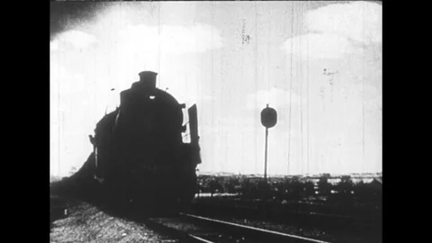 1950s: Weapons produced in Germany are places in a train and loaded into cargo Stock Footage