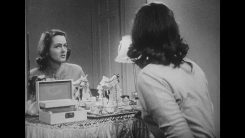 1950s: Wife looks at closed door. Woman taps table and thinks. Woman turns. Stock Footage