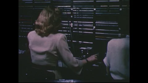1950s: Women working telephone switchboard / Circuits moving / Woman working Stock Footage