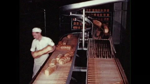 1950s: Worker sorting bread loaves from ... | Stock Video | Pond5