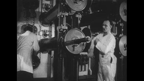 1950s: Worker turns rod in nuclear plant / Man uses scientific equipment / Close Stock Footage