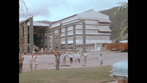 1950s: Workers leaving factory. Men line up. Stock Footage 219633728