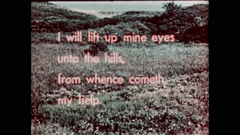1950s:Religious scripture text superimposed over mountainous forest. Open Stock Footage 232948209
