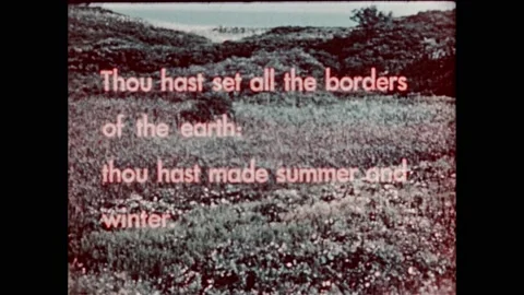 1950s:Religious scripture text superimposed over mountainous forest. River runs Stock Footage 232948286