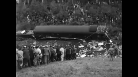 1951 - Around 100 people pull lines attached to a wrecked Rome-bound passenger Video stock 238633976