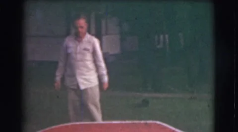 1951: man walks off smiling and waving to camera Stock Footage