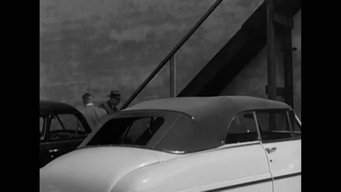 1951 - Men from the Ground Observer Corps get out of a car and walk to the top Stock Footage 226611914