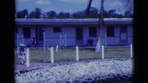 1951: people relaxing in front of the line house. FLORIDA Stock Footage