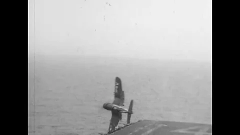 1951 - A plane flips off the flight deck of the USS Philippine Sea and crashes Stock Footage 112547083