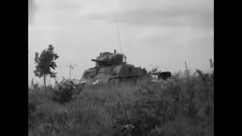 1951 - In a US Army training exercise, aggressor troops move towards an M7 B1 Stock Footage 164530766