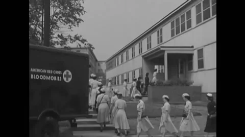 1951 - US Navy WAVES walk to a Red Cross building to donate blood. Stock Footage 221915115