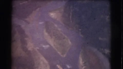 1951: view from an airplane of clouds, rivers, and suburban landscape CANADA Stock Footage