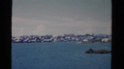 1951: a view of the ocean with various islands and hills in the background Stock Footage