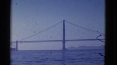 1952: a bridge is seen from a mountain area with greenery and trees Stock Footage