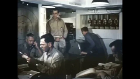 1952 - The busy joint operations room is shown aboard the USS Estes amphibious Stock Footage 85648531