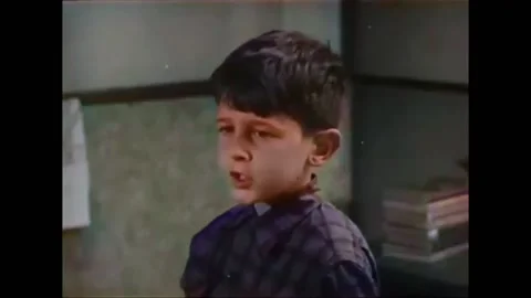 1952 - A first grader is sent to the principal's office for hitting a boy. Stock Footage 246361608