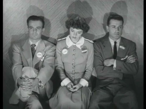 1952, A group trapped in an elevator during a practice air raid discuss the Stock Footage 83215234
