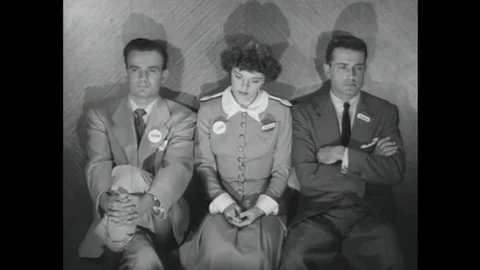 1952 A group trapped in an elevator during a practice air raid discuss the Stock Footage 115668307